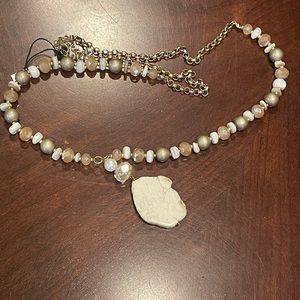 🎀Boutique necklace. NWT. Beautiful beaded necklace with a stone pendant.Neutral